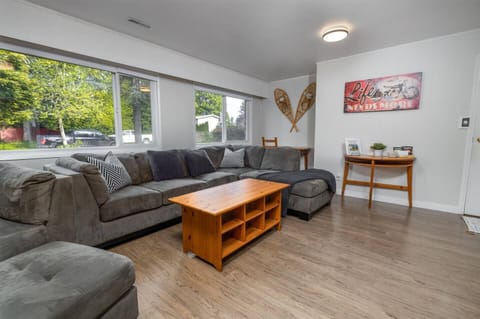 Oversized sectional with double hide-a-bed that’s very easy to set up (3" thick cooling mattress topper available)
50” 4K Roku TV with Netflix, Disney+, PrimeTV.
Desk area in the back nook. Gas fireplace is easy to use.
Games + toys in tv stand.