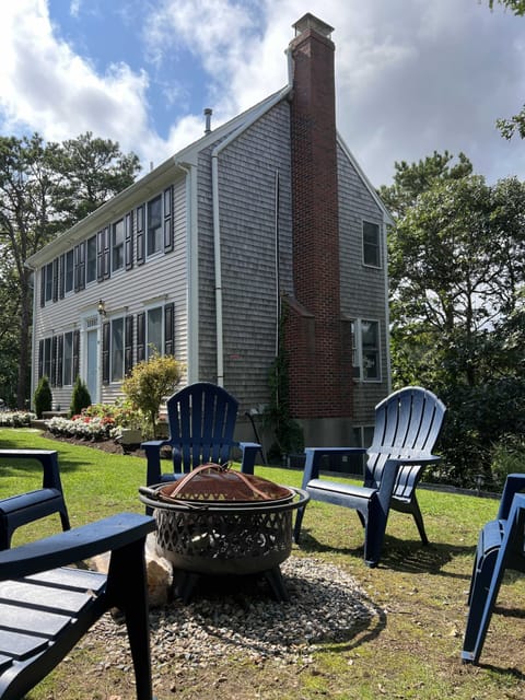 Front yard with fire pit and front entrance to house