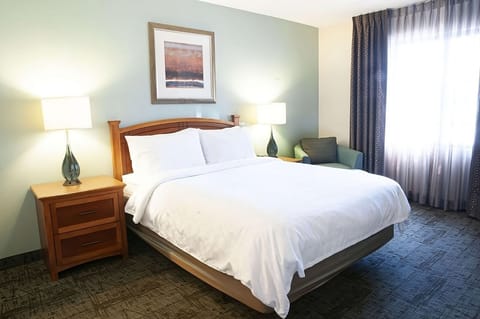 Sink into a cloud-soft king bed after busy days.