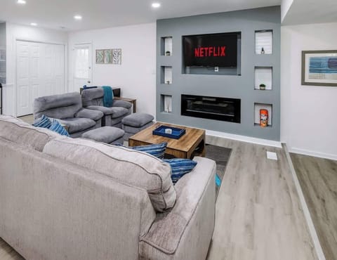 Cozy nights await with a smart TV, fireplace, and shelves of games—family fun made easy.