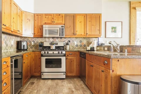 Gas range, full size fridge, beverage fridge, dishwasher, microwave & air fryer