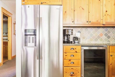 Kitchen with full size fridge, beverage fridge, pot & k-cup coffee maker