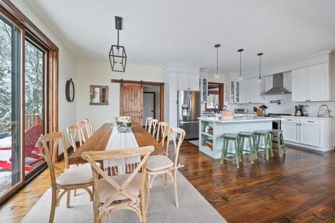 Featuring a dining table that seats up to 10 and a kitchen island that seats 4