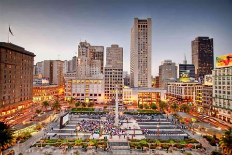 Step into the city’s energy with vibrant streets nearby.