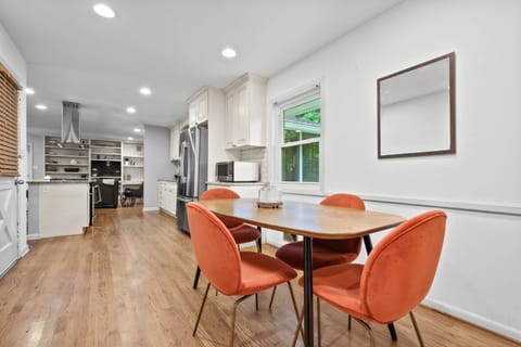 Breakfast nook, the door to the left goes into the garage. Check out these beautiful wood floors through out the house on the main floor.