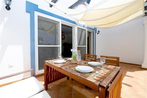 Outdoor dining area for four guests on the private terrace