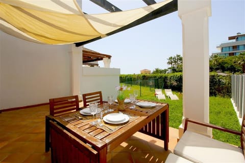 Beautiful private terrace with outdoor dining area and private garden
