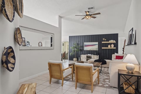 Plush and modern living room with extra seating and blankets!