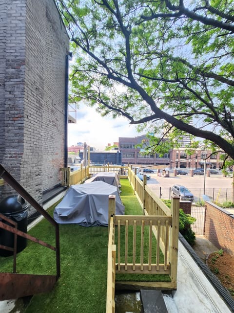 A roof deck with a grill