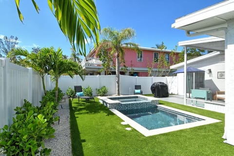 Pool area with grill and loungers