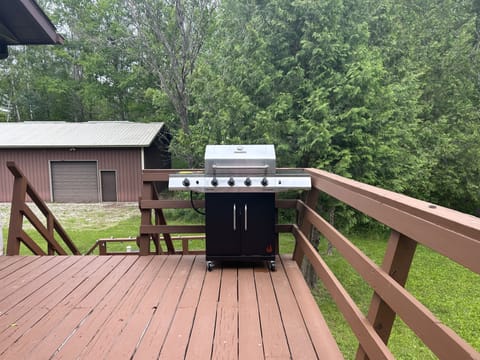 Gas grill with burner and large deck