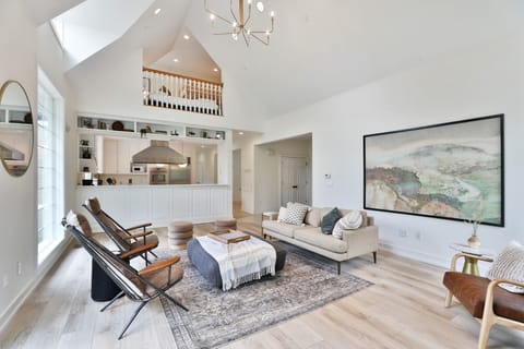 High ceiling main living room area with lake views. Main Floor (no stairs).