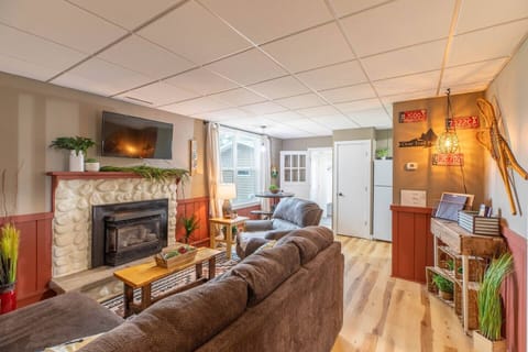 Indulge in comfort and style in our living room, featuring plush sofas, and elegant chairs. Cozy up by the fireplace, and unwind with entertainment on the TV.