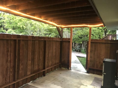 Private patio with gate to access hot tub