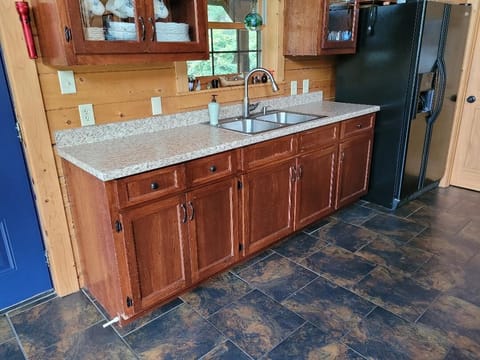 Full kitchen with ample dishes and cookware