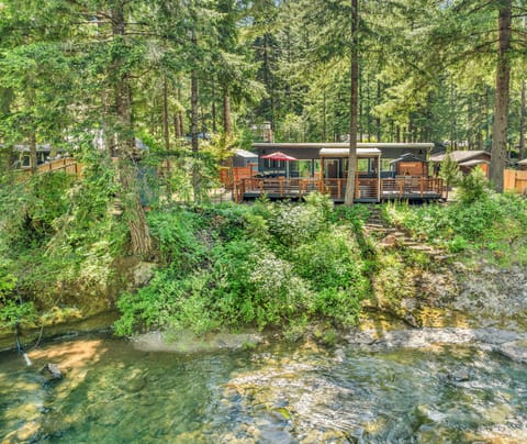 The cabin is set right on Little River, providing a serene waterfront setting.
