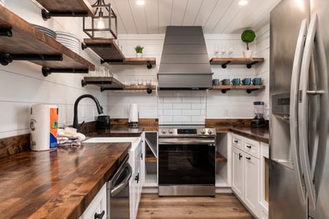 Stainless steel appliances and wooden counters