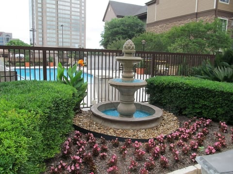 Stroll by the bubbling fountain and enjoy garden serenity.