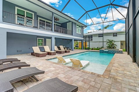 The outdoor space behind the home is nothing short of a dream - heated pool, spa, sunbathing ledge, ample reclining lounges and seating/dining areas.