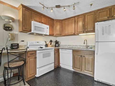 Kitchen is fully-equipped with pots, pans & utensils