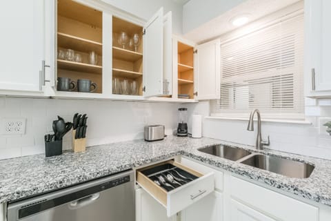 Kitchen with extra amenities:

Coffee maker, blender, microwave, toaster, flatware, dishes, drink glasses, mugs, pots, pans, cutting board, cooking utensils, dish soap, paper towels, cleaning products, oil, sugar, spices, tea, coffee...
