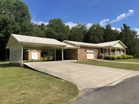 Covered parking for 2 boats/trucks (22 ft wide/70 ft long).  Additional parking in driveway (12 ft by 45 ft)