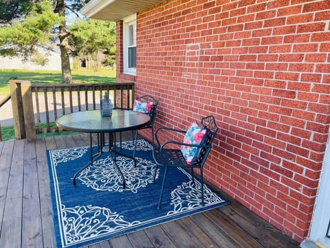 Enjoy meals or coffee on the back deck overlooking the large private backyard. 