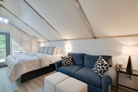 Spacious glamping tent featuring a private hot tub, king bed, and scenic views. Experience luxury camping in the heart of North Alabama.