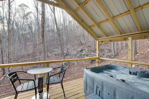 Spacious glamping tent featuring a private hot tub, king bed, and scenic views. Experience luxury camping in the heart of North Alabama.
