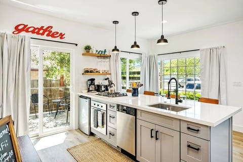newly remodeled kitchen, 4 burner stove, oven, dishwasher and mini fridge