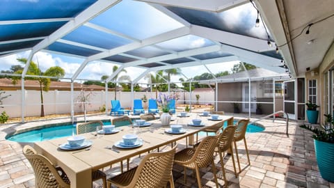 Dine with a view — enjoy your meals overlooking a sparkling pool in a serene backyard setting!
