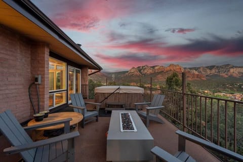 The firepit and hut tube on the deck at dusk