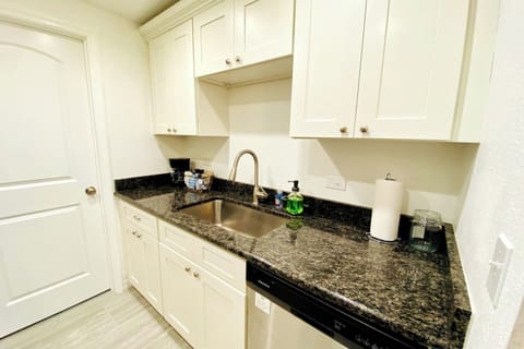 The bright kitchen is ready for your family meals - or takeout!