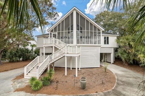 Welcome to 3634 Pompano Court. This 4 bedroom, 3 bath home is the perfect beach cottage to escape from it all! Winding front stairs up to the expansive screen porch