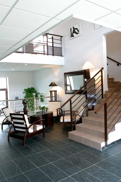 Gather downstairs for quiet conversation in a bright, open atrium.