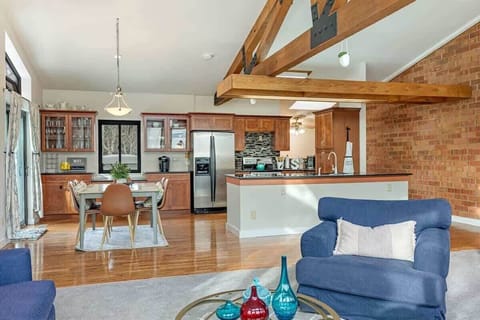 The living, dining, and kitchen areas comprise the entire top floor of the unit.