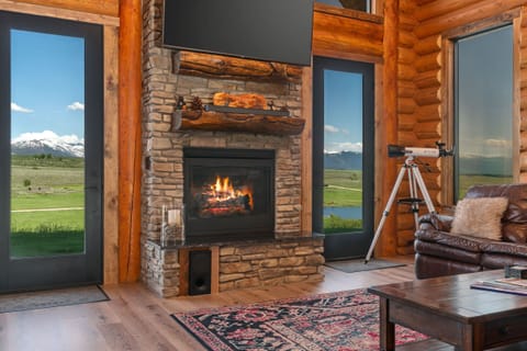 Take in the stunning views and cozy warmth in the living room.