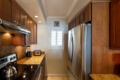 Remodeled kitchen with upgraded stainless appliances.