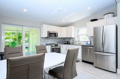 Kitchen with slider to lanai, will have blinds