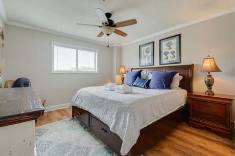 Spacious master bedroom with a king sized bed. 