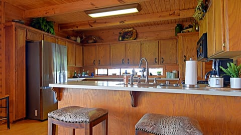 Well stocked kitchen with everything to cook and serve meals for your stay