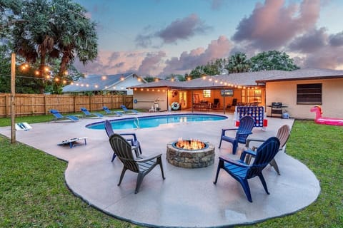 Backyard with fire pit, grill, corn hole, giant connect 4, giant jenga, pool floats & toys. 
And so much more!