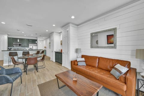 Open floor plan with natural lighting in the living area