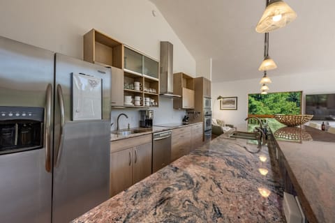 Whip up your favorite creations in this well-appointed kitchen, with all stainless appliances and beautiful counter tops