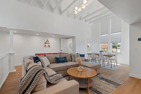 Relax in the cozy living room with comfortable furniture and chairs. Enjoy entertainment with the nice TV and engage in friendly competition with the pool table. Experience a great stay filled with comfort, fun, and memorable moments.