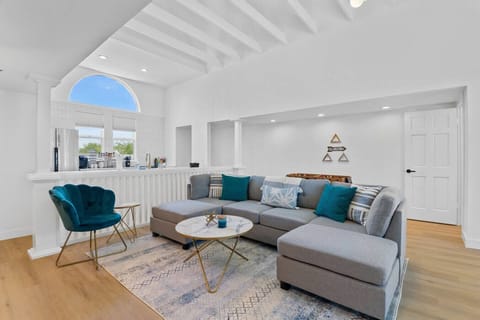 Step into our delightful house and unwind in the cozy living room set, featuring comfortable furniture and chairs. Embark on a great experience of comfort, relaxation, and joyful togetherness in this inviting space.