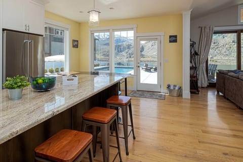 Gourmet kitchen with pool and river views