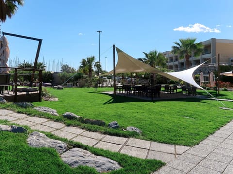 Sky, Plant, Shade, Tree, Cloud, Land Lot, Tent, Urban Design, Building, Leisure