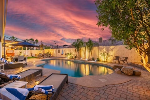 Private heated pool with fire pit and outdoor dining