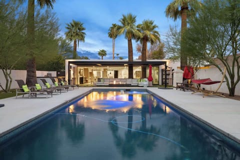 Resort pool with Baja shelf pool and jacuzzi, lounge chairs, hammock, fire pit! Perfect for your large group of up to 23!